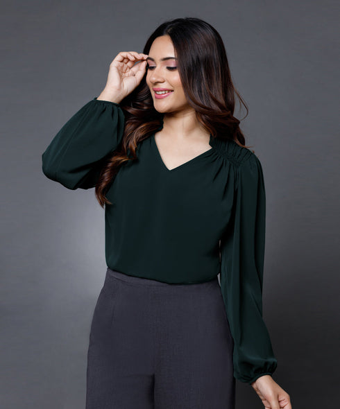 Side smocking done solid green top