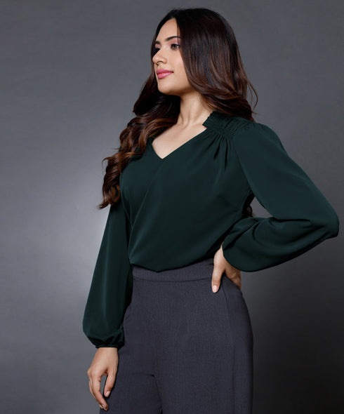Side smocking done solid green top